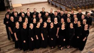 Choir group smiling and posing for group picture